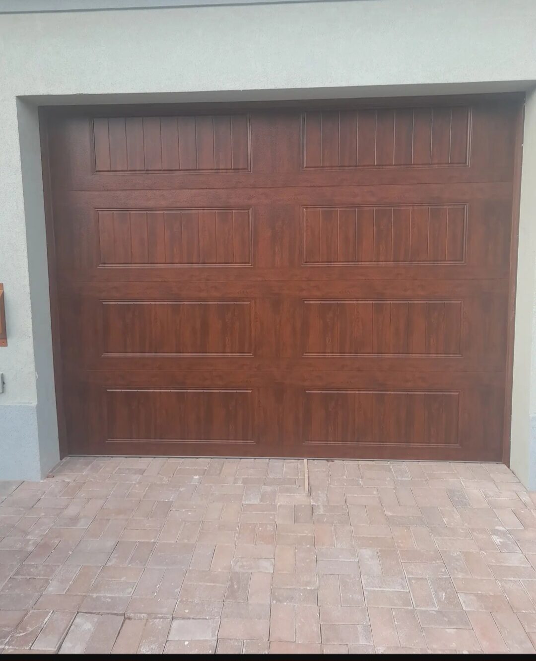 Wood-finish garage door installation