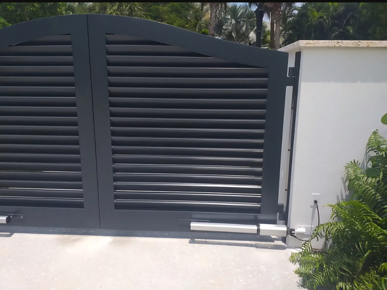 Arched double swing gate installation